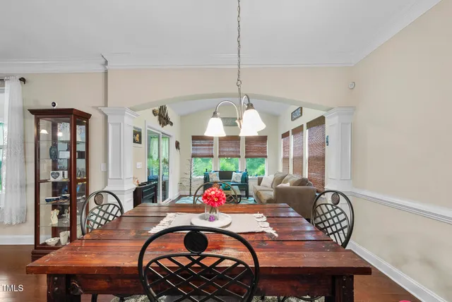 a view of a dining room with furniture window and outside view