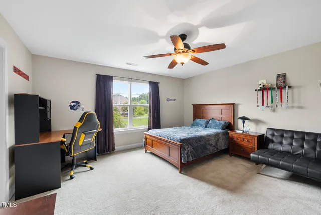 a bedroom with furniture and a gym equipment