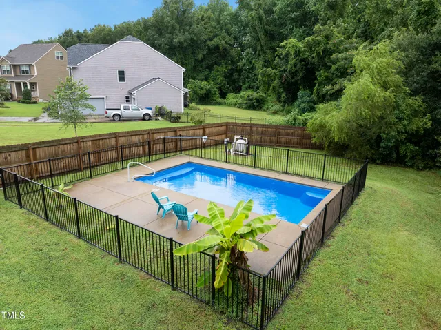 swimming pool view with a outdoor seating