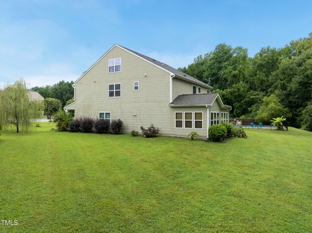 a view of a backyard of the house