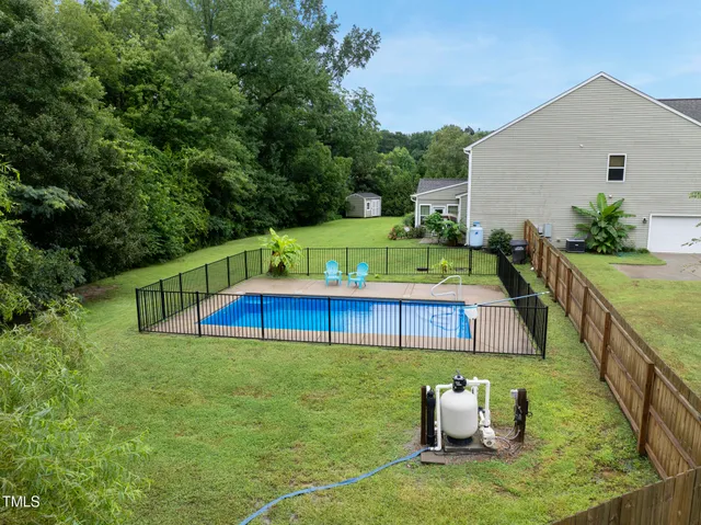 a balcony with table and chairs