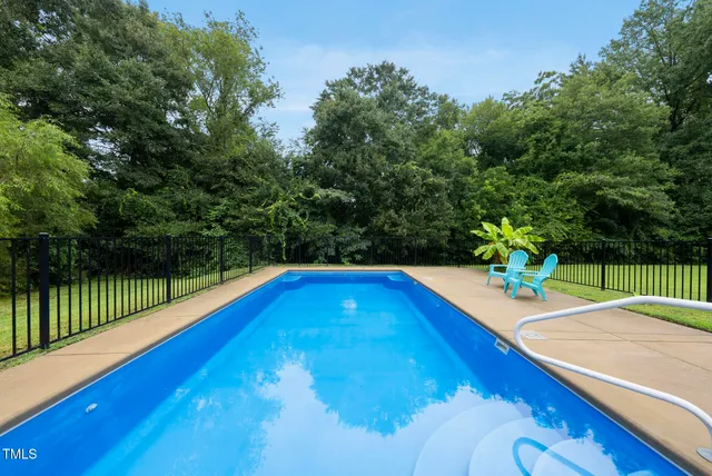 a view of swimming pool with a patio