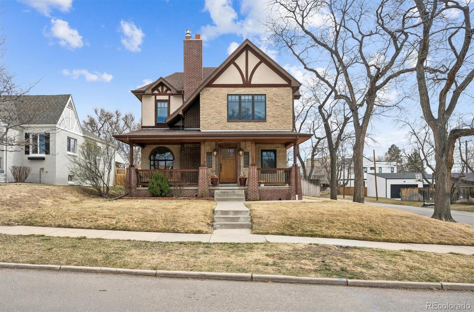 2700 Stuart Street Denver, CO 80212 - Photo 1 of 49 a front view of a house with garden and porch