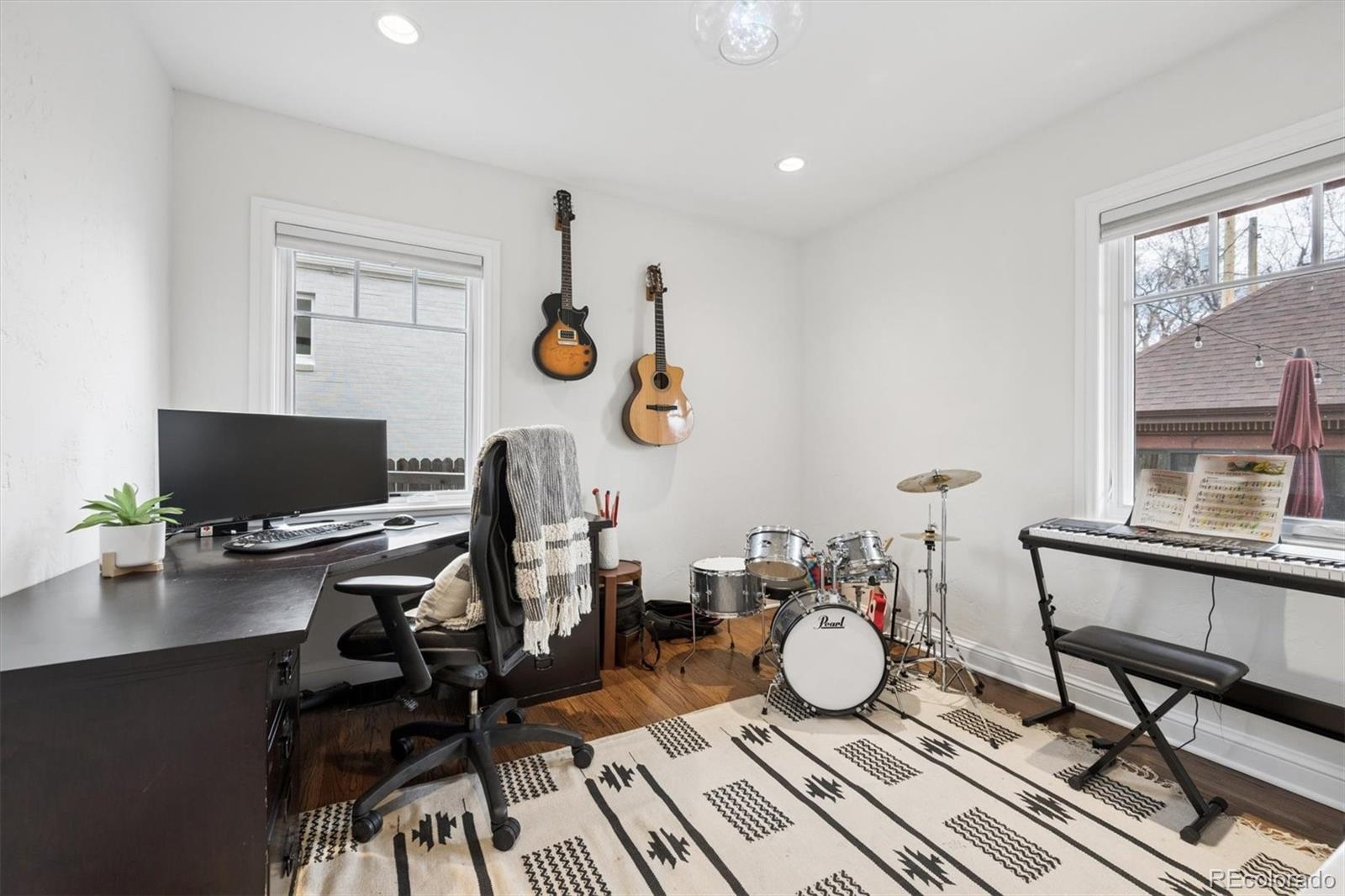 2700 Stuart Street Denver, CO 80212 - Photo 13 of 49 a view of a workspace with furniture and a window