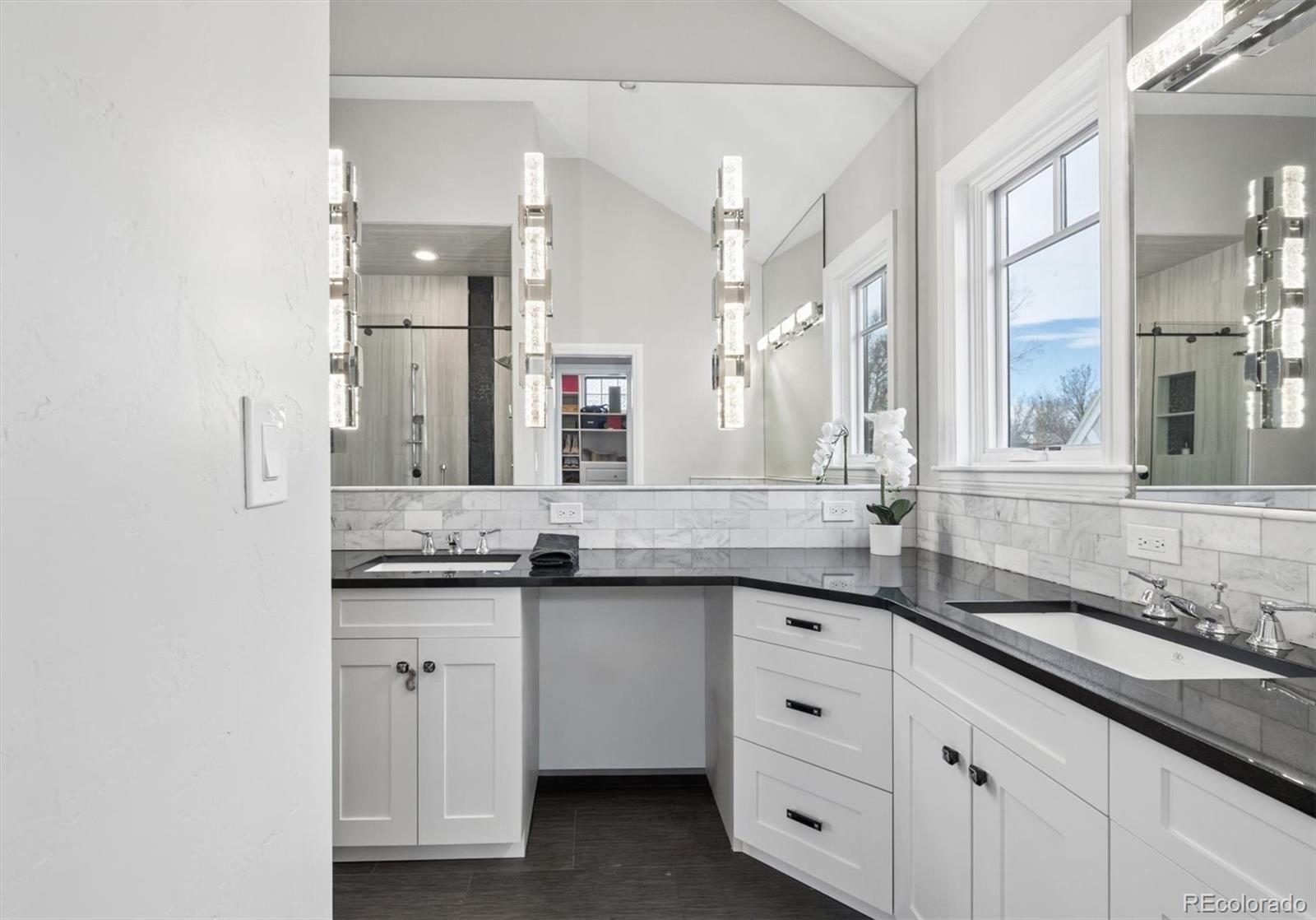 2700 Stuart Street Denver, CO 80212 - Photo 17 of 49 a bathroom with a granite countertop sink double and mirror
