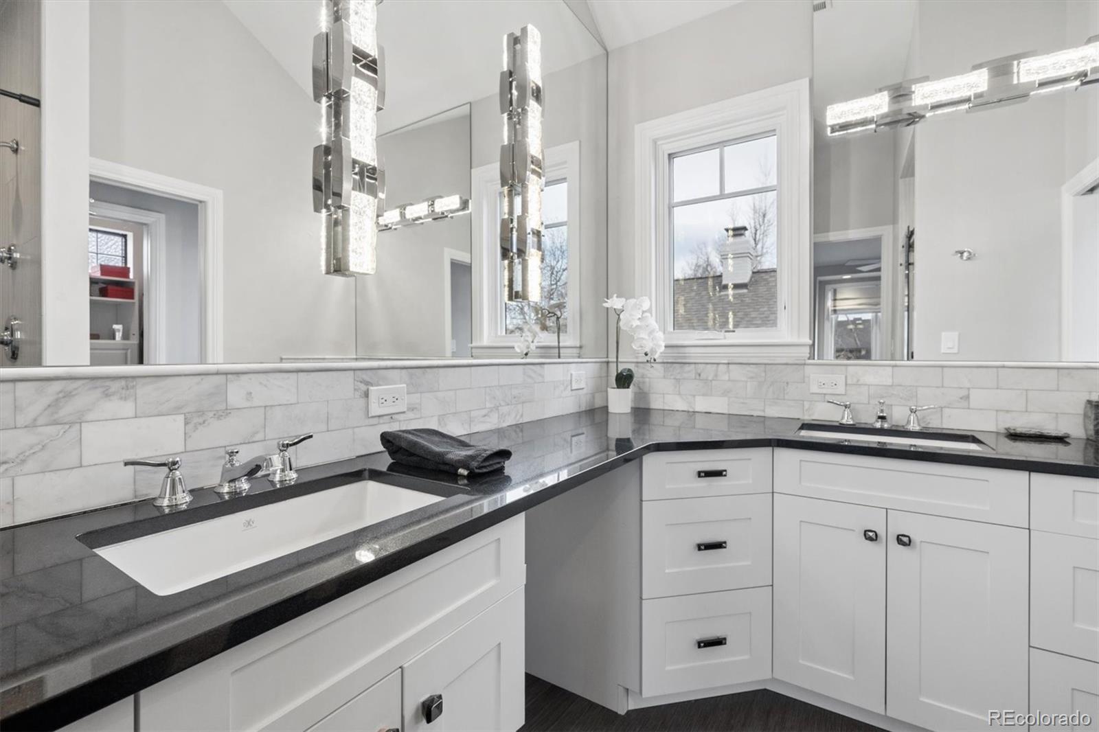 2700 Stuart Street Denver, CO 80212 - Photo 18 of 49 a bathroom with a sink and a mirror