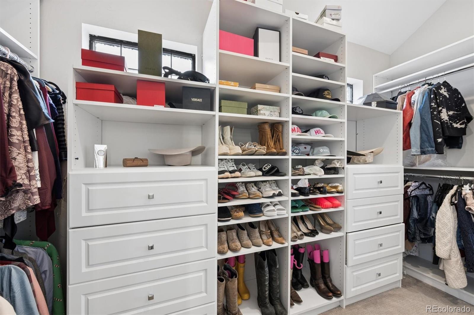 2700 Stuart Street Denver, CO 80212 - Photo 19 of 49 a view of walk in closet with clothes and shoes