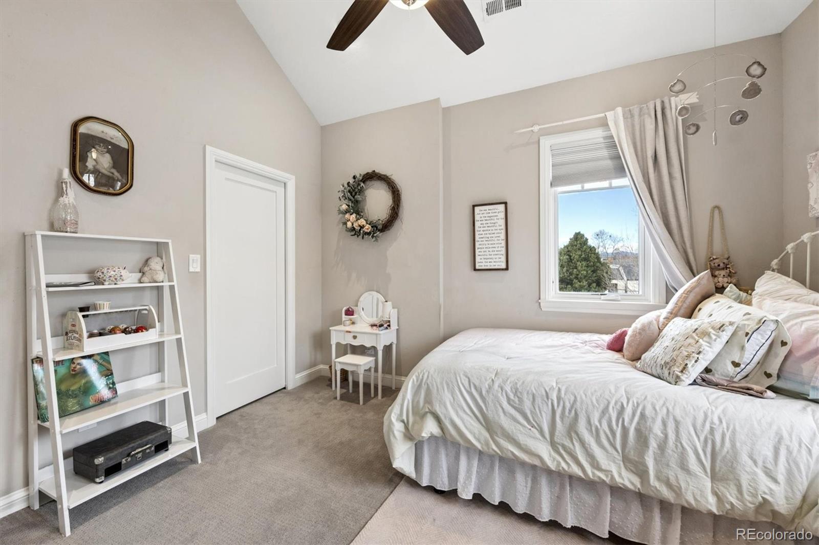 2700 Stuart Street Denver, CO 80212 - Photo 20 of 49 a bedroom with a bed and a window