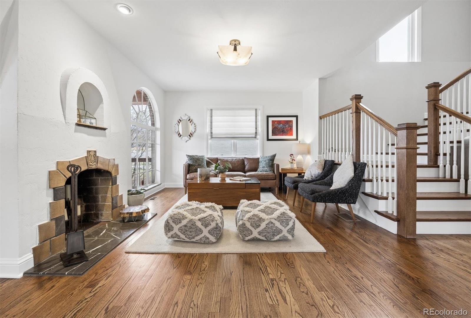 2700 Stuart Street Denver, CO 80212 - Photo 2 of 49 a living room with furniture and a fireplace