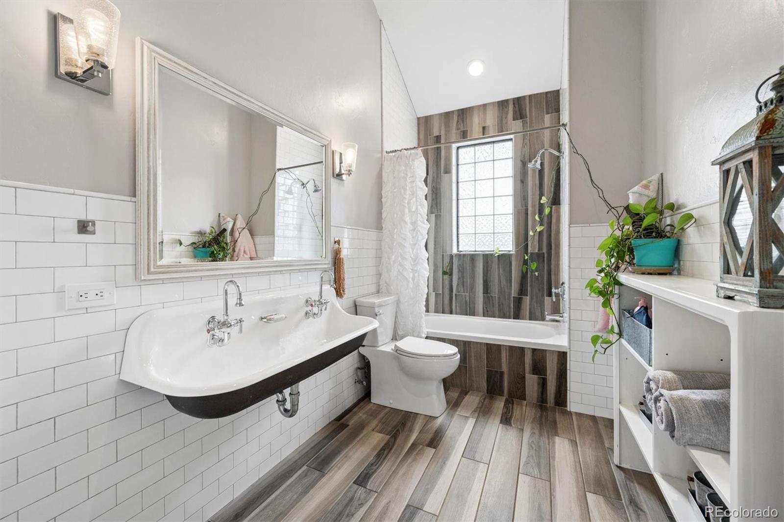 2700 Stuart Street Denver, CO 80212 - Photo 24 of 49 a bathroom with a sink and a mirror
