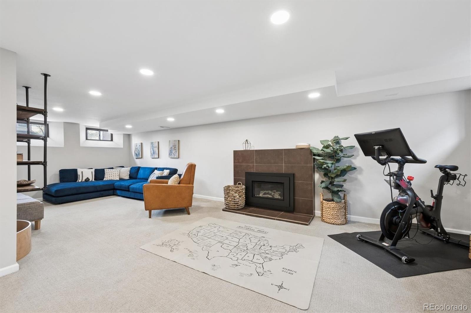 2700 Stuart Street Denver, CO 80212 - Photo 25 of 49 a living room with furniture and a fireplace
