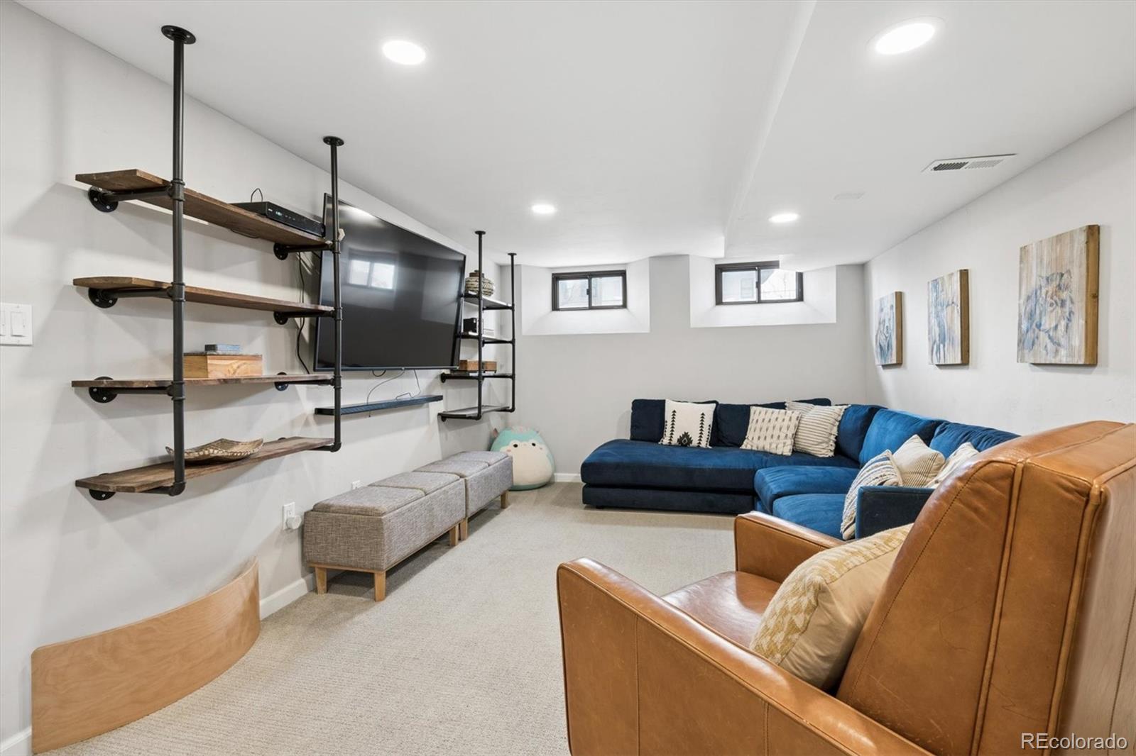 2700 Stuart Street Denver, CO 80212 - Photo 26 of 49 a living room with furniture and a flat screen tv