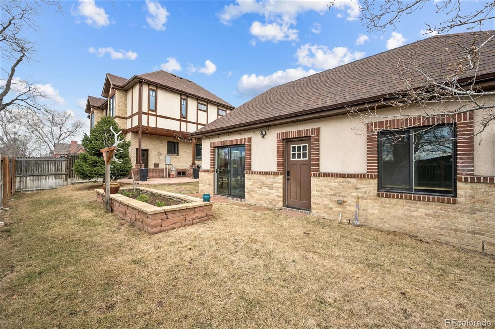 2700 Stuart Street Denver, CO 80212 - Photo 34 of 49 a front view of a house with a yard and garage