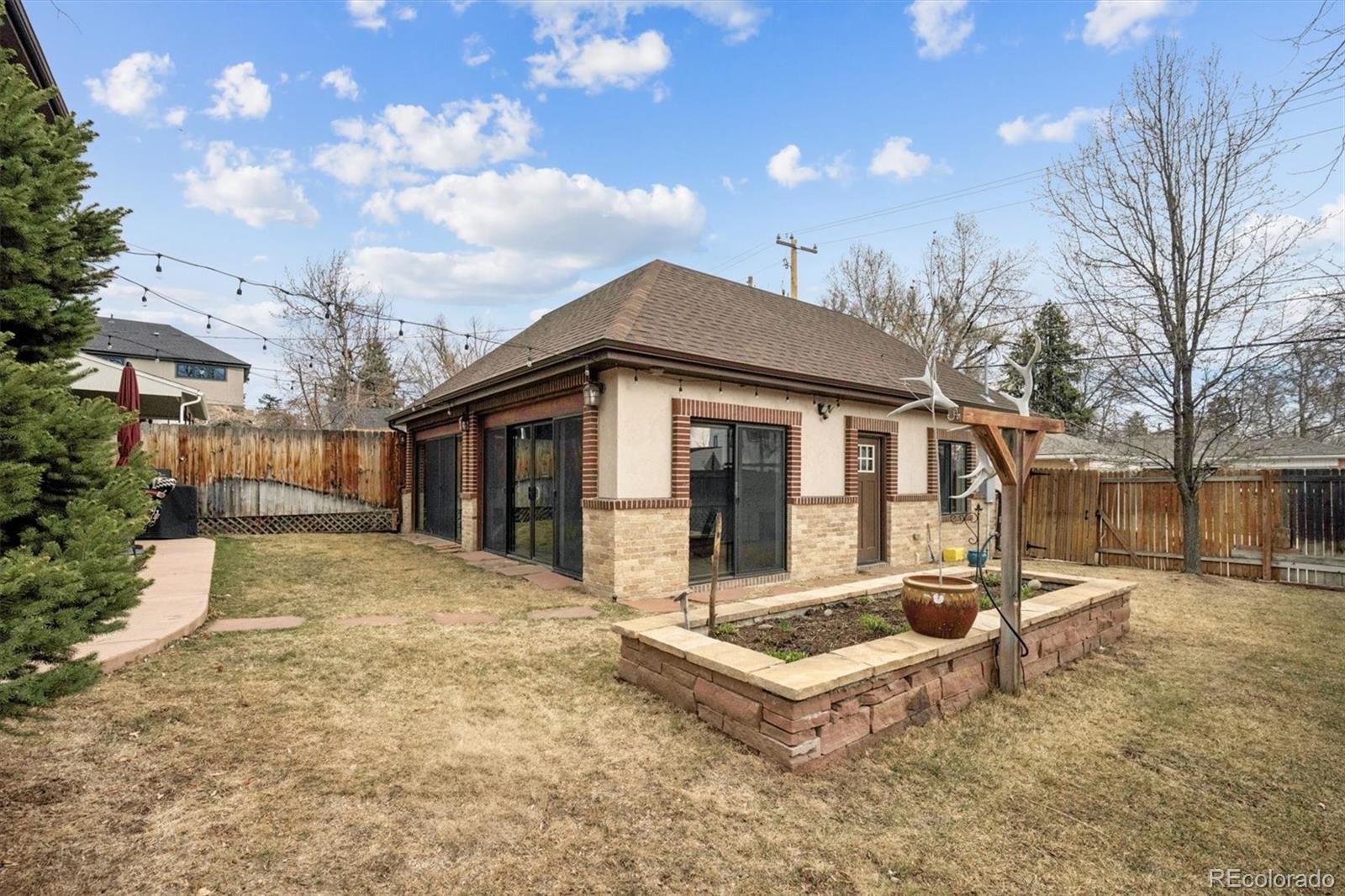2700 Stuart Street Denver, CO 80212 - Photo 35 of 49 a front view of house with yard outdoor seating and barbeque oven