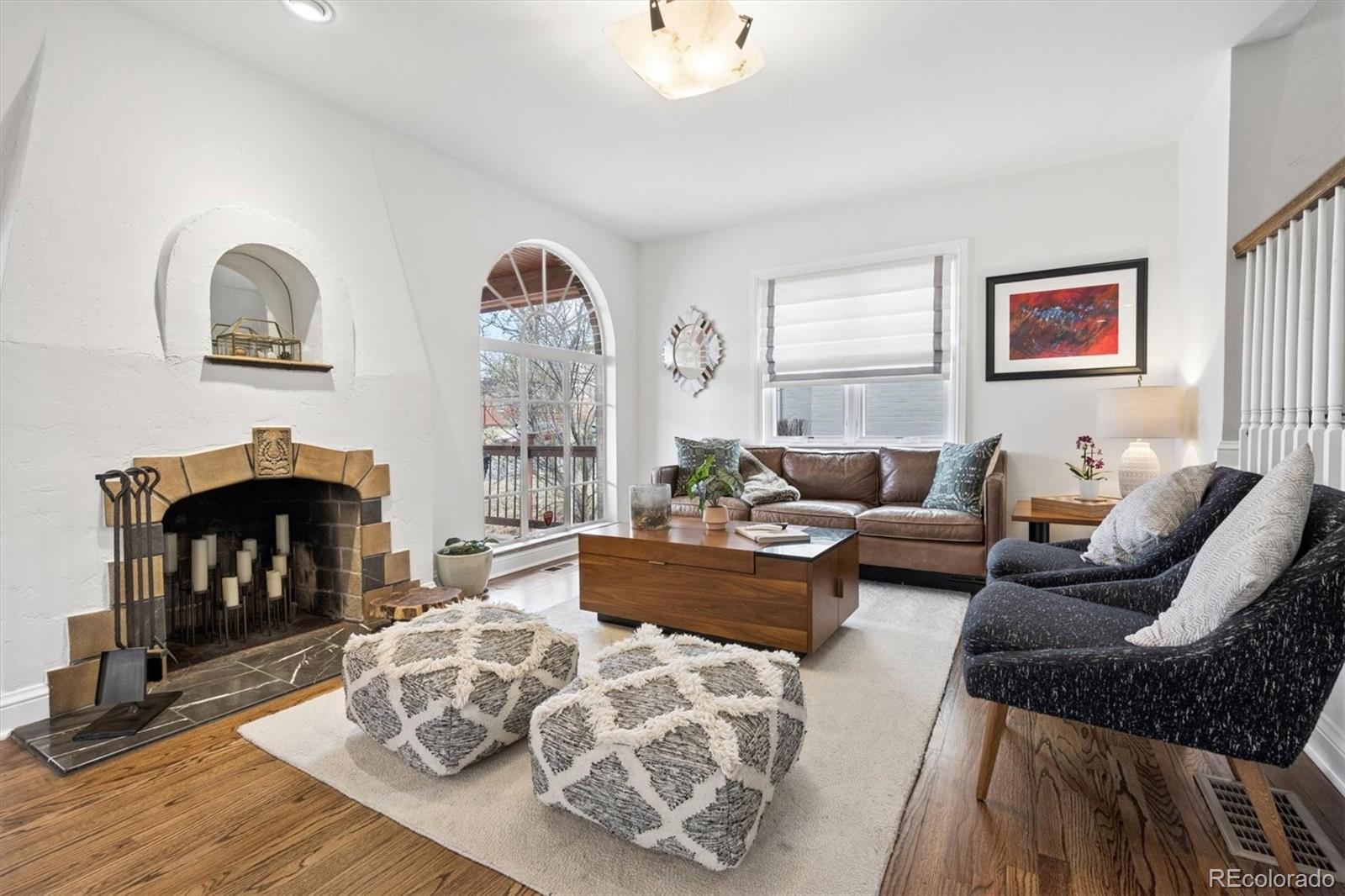 2700 Stuart Street Denver, CO 80212 - Photo 4 of 49 a living room with furniture and a fireplace