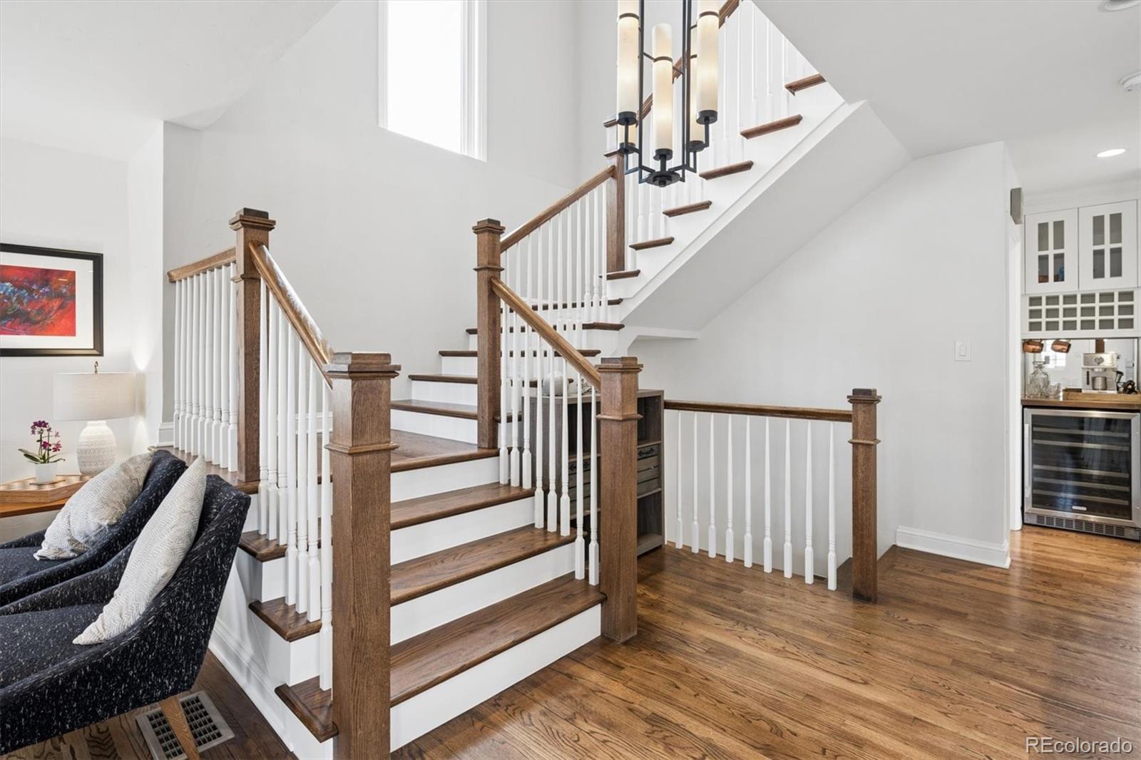 2700 Stuart Street Denver, CO 80212 - Photo 10 of 49 a view of entryway with wooden floor and stairs