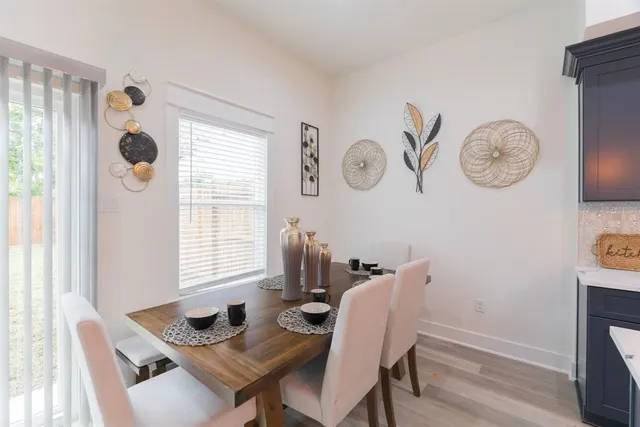 a kitchen with a table chairs and a stove