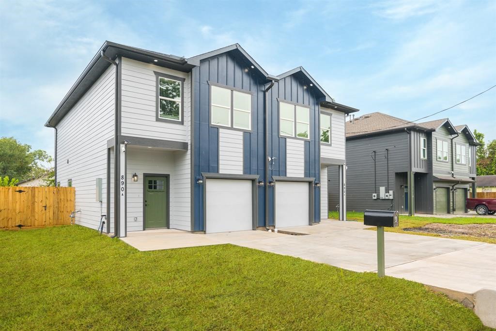 890 Lucky Street, Unit A Houston, TX 77088 - Photo 2 of 48 a front view of a house with a garden