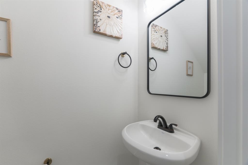 890 Lucky Street, Unit A Houston, TX 77088 - Photo 22 of 48 a bathroom with a sink and a mirror