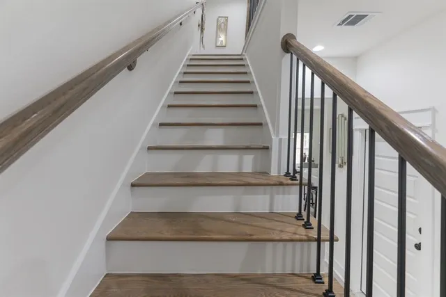 a bathroom with a shower and a sink