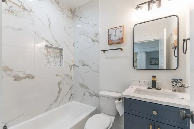 a bedroom with a bed and a cabinets