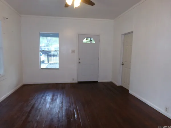 a view of a kitchen with sink and cabinets