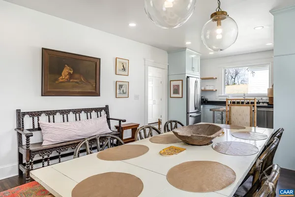 a kitchen with a table and chairs in it