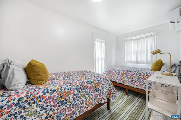 a bathroom with a shower a toilet and a bathtub