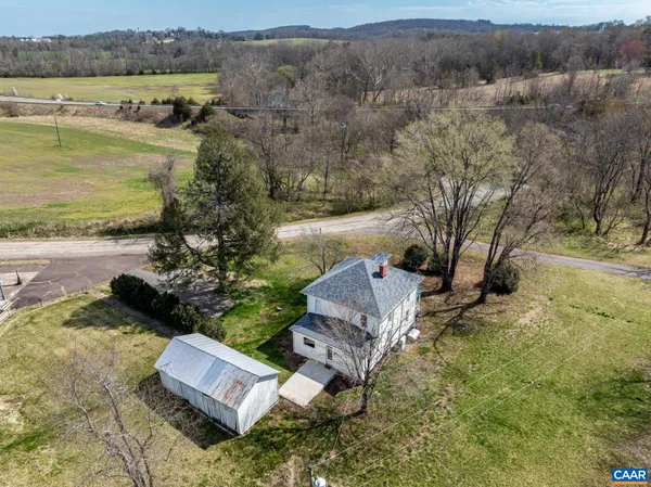 an aerial view of a house with lake view