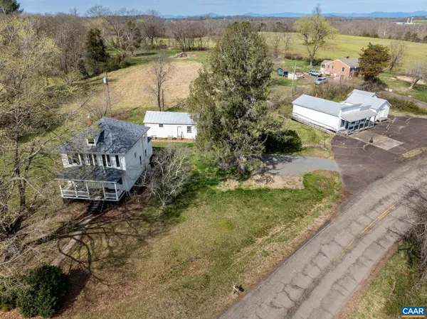 an aerial view of a house with outdoor space