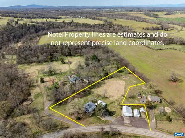 a view of a two chairs with the view of outdoor space