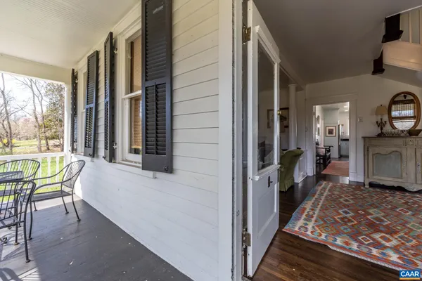 a very nice looking living room with a couch and a dresser