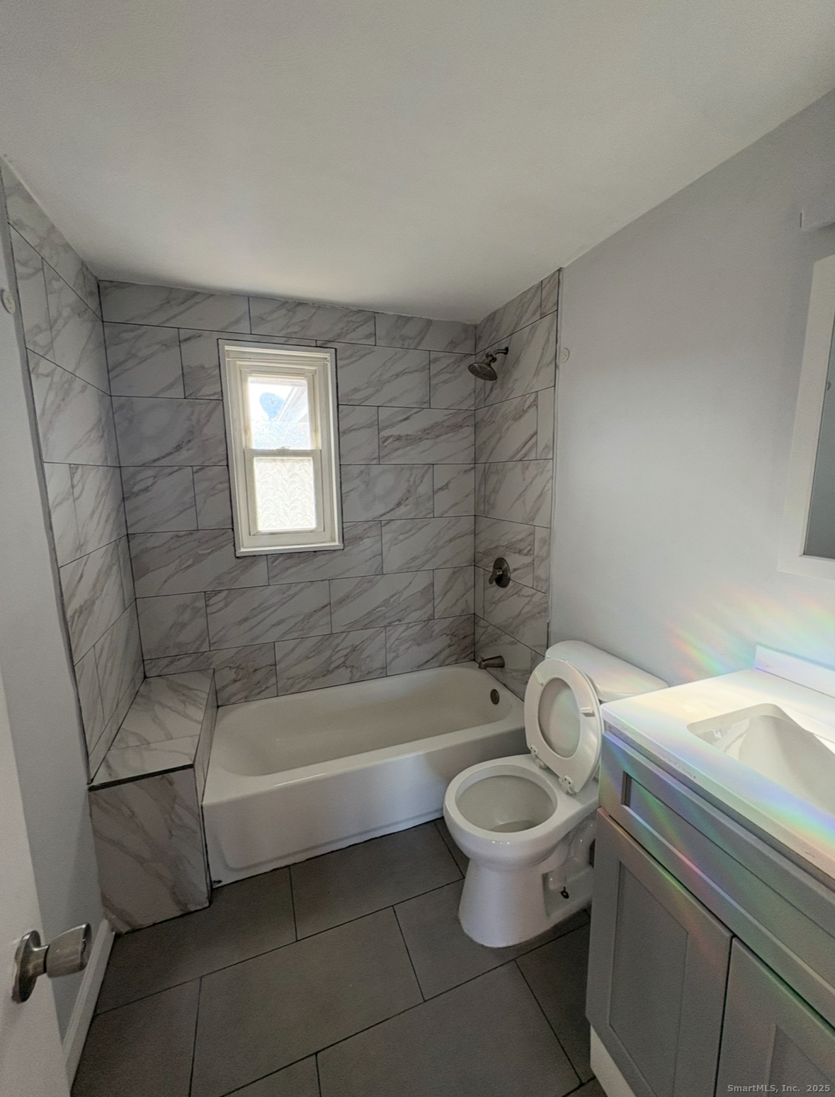 554 Eastern Street, Unit 3 New Haven, CT 06513 - Photo 4 of 5 a bathroom with a toilet a sink and bathtub