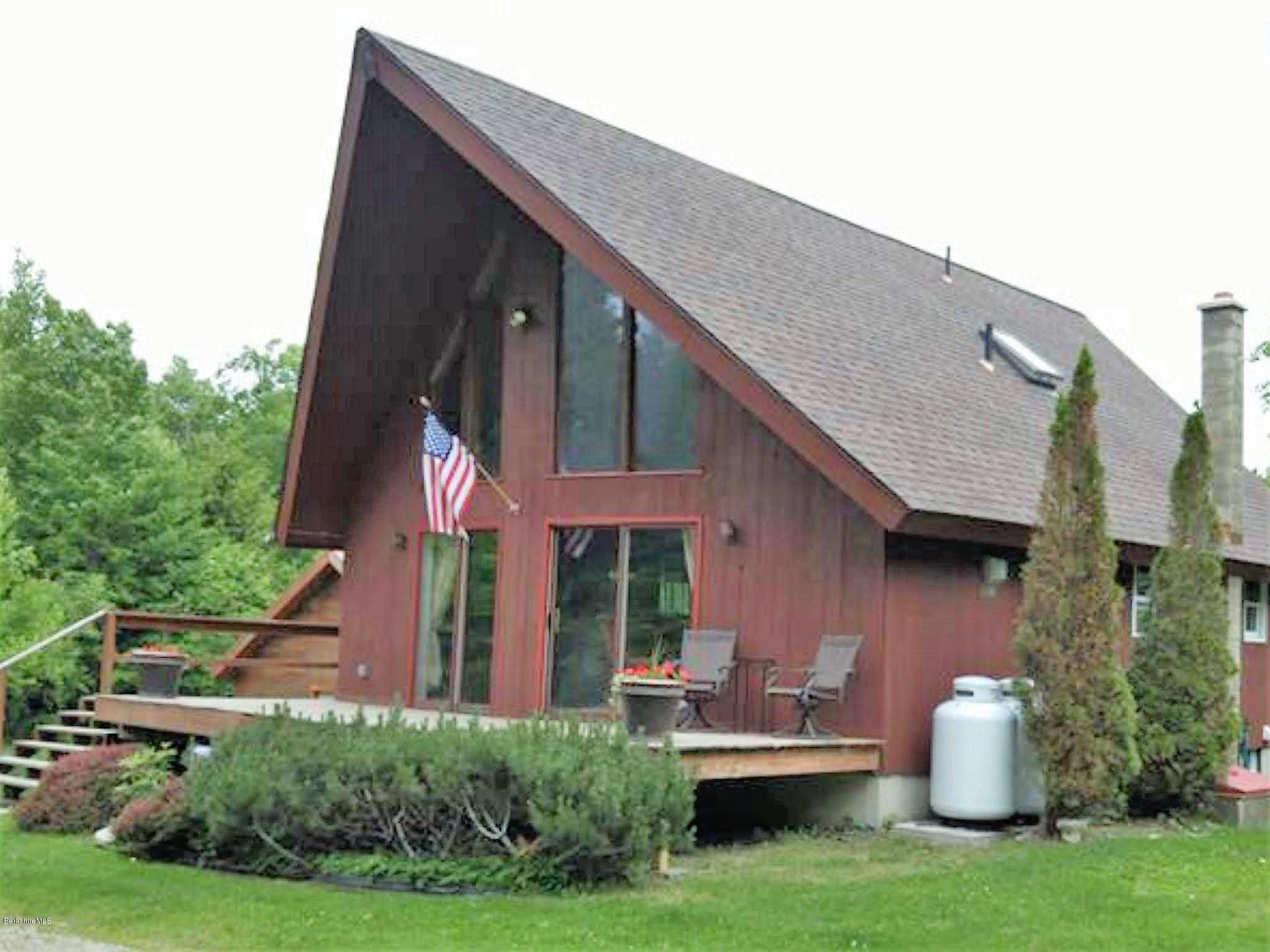 25 Kreutzer Road Peru, MA 01235 - Photo 1 of 10 a front view of a house with garden