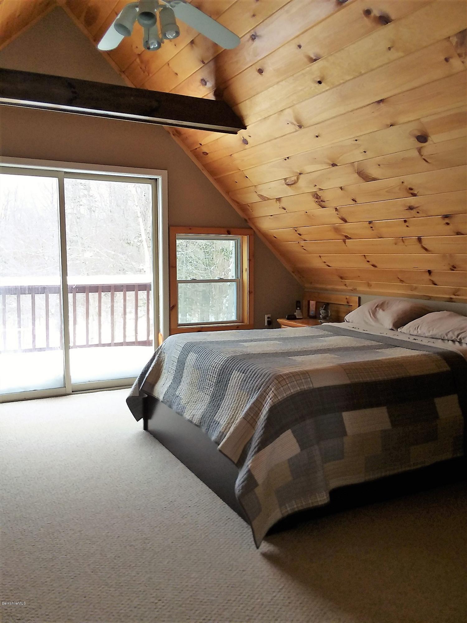 25 Kreutzer Road Peru, MA 01235 - Photo 6 of 10 a spacious bedroom with a bed and a large window