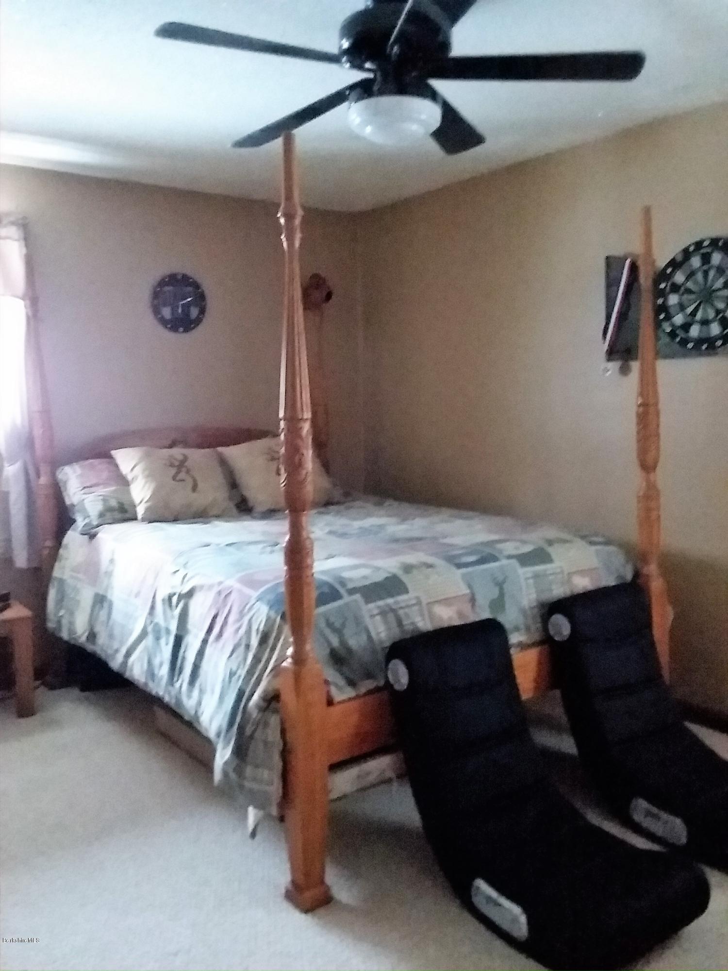 25 Kreutzer Road Peru, MA 01235 - Photo 7 of 10 a bedroom with a bed and a lamp on the dresser