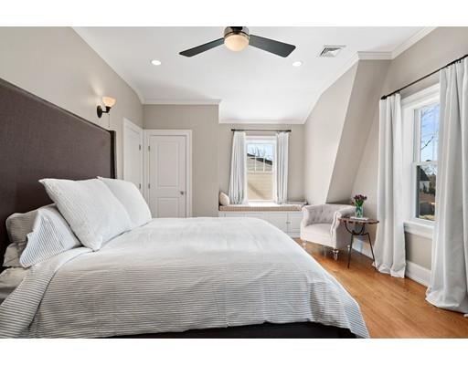 41 Pilgrim Road Marblehead, MA 01945 - Photo 13 of 30 a bedroom with a bed and a chandelier