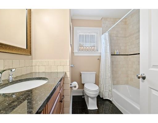 41 Pilgrim Road Marblehead, MA 01945 - Photo 21 of 30 a bathroom with a sink toilet a mirror and shower