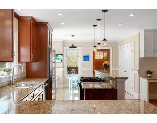 41 Pilgrim Road Marblehead, MA 01945 - Photo 6 of 30 a kitchen with stainless steel appliances granite countertop a refrigerator a stove and a sink