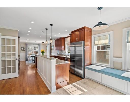 41 Pilgrim Road Marblehead, MA 01945 - Photo 7 of 30 a open kitchen with stainless steel appliances granite countertop a refrigerator a stove oven and a sink with granite countertops