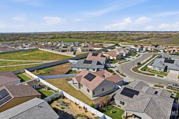 an aerial view of a city with ocean view