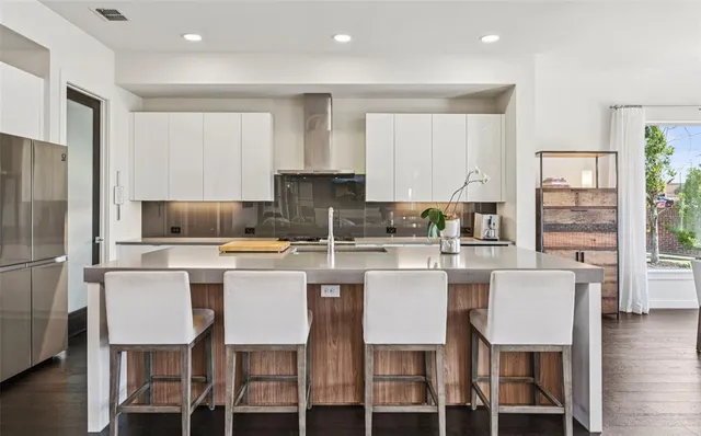 a kitchen with a sink stove and refrigerator