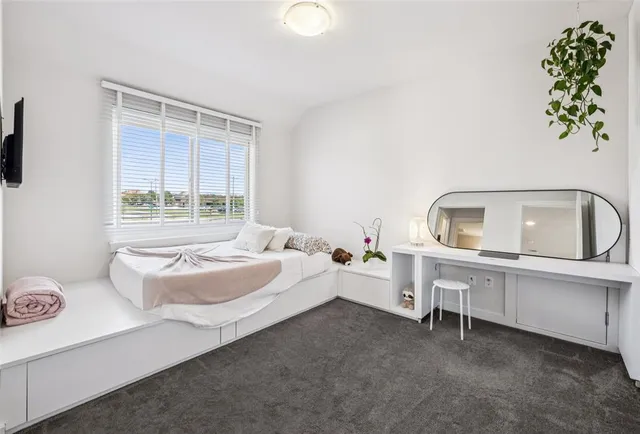 a room with furniture pool table and flat screen tv