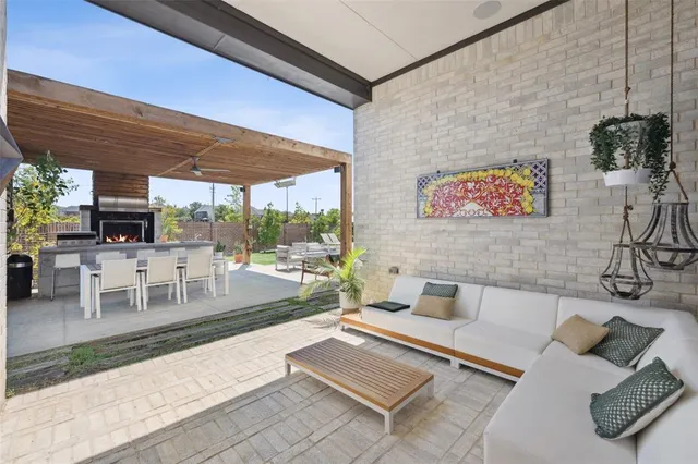 a outdoor dining space with furniture and outdoor view