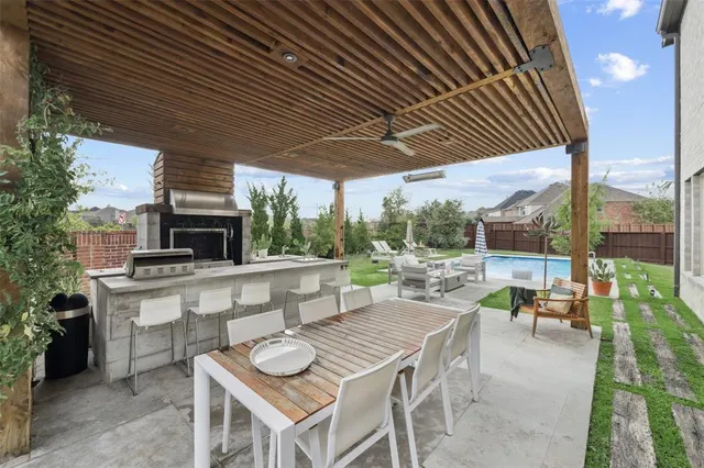 a outdoor space with lots of tables a garden and chairs