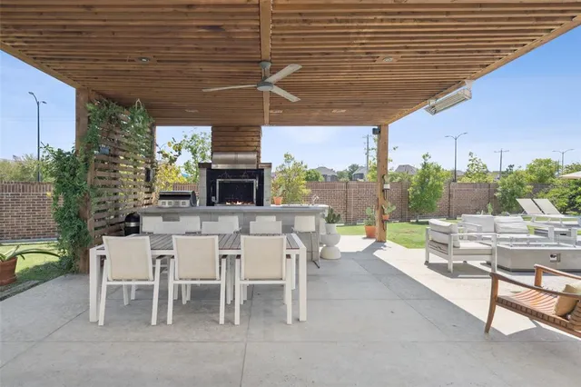 a view of a porch with furniture and garden