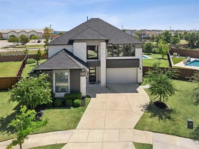 an aerial view of residential building and ocean