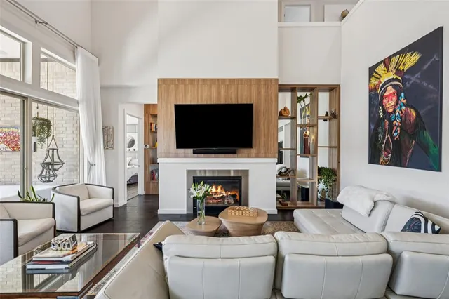 a living room with furniture kitchen view and a table