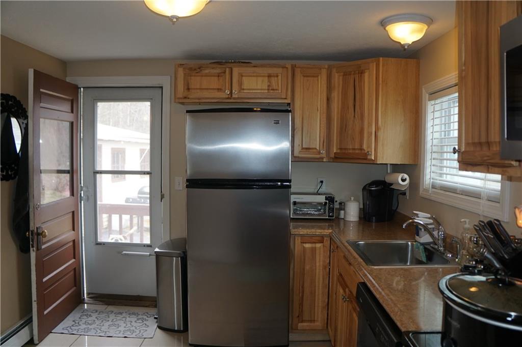 44 Forest Street Saco, ME 04072 - Photo 18 of 32 Kitchen view with the back door exit.