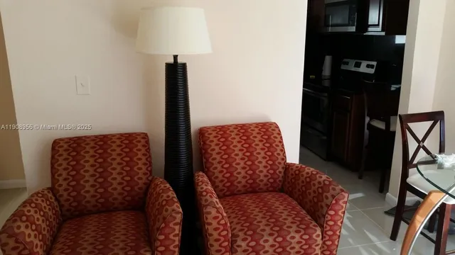 a balcony with furniture and a lamp